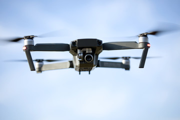 drone quad copter with high resolution digital camera on the sky