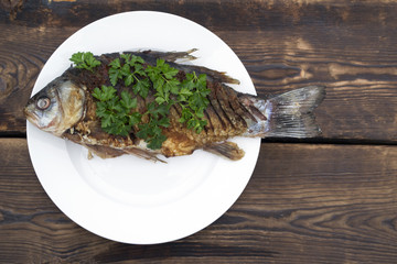 Fried fish on a white plate