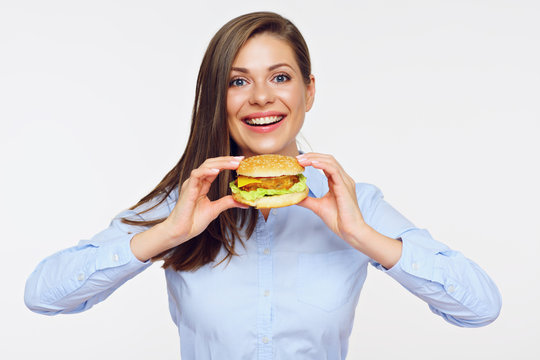 Smiling woman holding burger. Isolated portrait