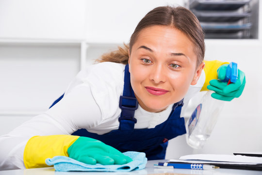 Woman cleaning at company office