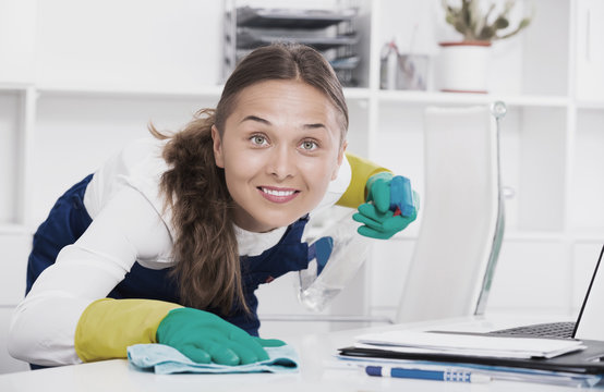 Woman cleaning at company office