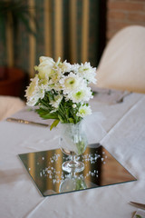 dinning table set on wedding with flowers
