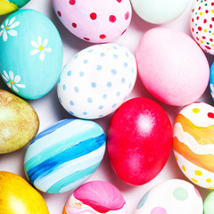 Easter background with painted Easter eggs. Top view with copy space. Happy Easter!.