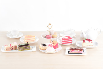 Beautiful cake and dessert on wooden table in pastel color - soft focus