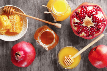 Composition with honey and fruit on wooden background