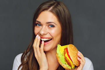 Close up portrait of woman eating burger