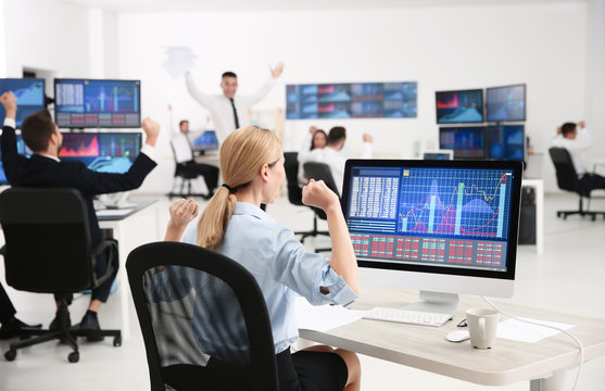 Female stock trader working in office