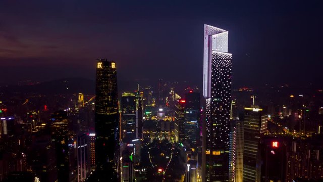 night sunset time illuminated guangzhou downtown cityscape aerial panorama 4k timelapse china
