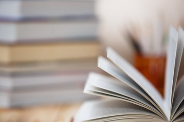Textbooks and books on a wooden table
