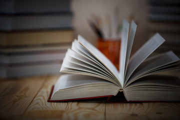 Textbooks and books on a wooden table