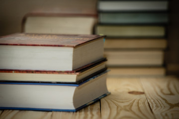 Textbooks and books on a wooden table