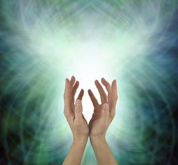 Beaming Beautiful Heart Chakra Healing Energy  - female hands reaching upwards sending heart energy out against a green energy matrix formation background  with copy space
