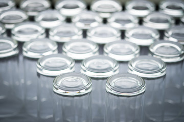 Abstract background of many empty glass of water placed on a table prepared for guests to dining in restaurant.