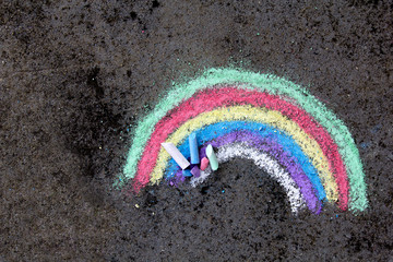  chalk drawing on asphalt: colorful rainbow