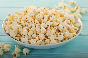 Cheddar cheese popcorn in a white bowl