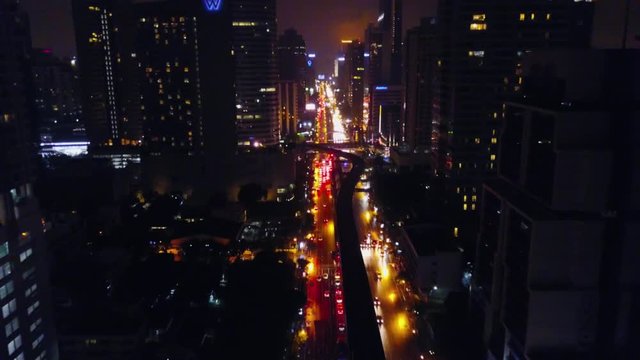A massive highway intersection from above at night in Shinjuku, Tokyo, Japan. Aerial view of a massive highway intersection at night in Shinjuku, Tokyo, Japan. Tokyo skyline at night