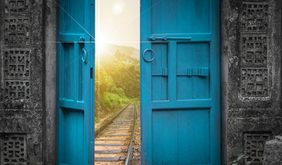 railway tracks behind open door
