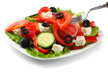 Square plate of greek salad isolated on white. fresh vegetable salad