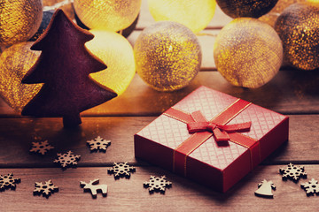 Beautiful lanterns garlands like balls, fir tree shape gingerbread cookie and gift box 