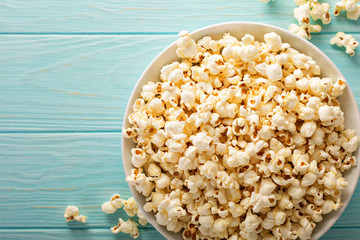 Cheddar cheese popcorn in a white bowl