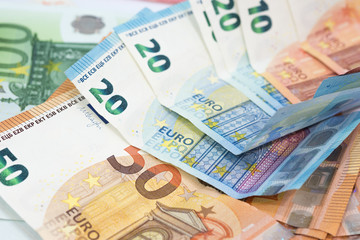Euro money background from many euro banknotes in different value.