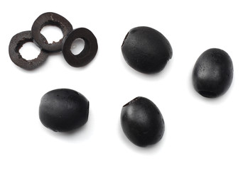 Marinated slices black olives isolated on white background. top view