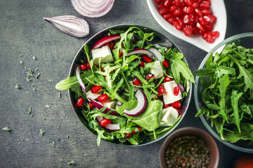 Bowl with fresh tasty salad on table