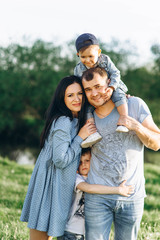 Fototapeta premium Family Dad Mom and Children in the Field