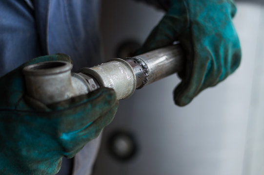 Metal pipes in hands