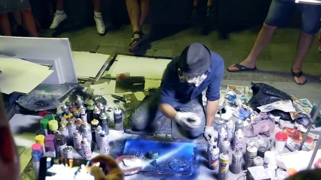 man drawing, night portrait, graffiti making