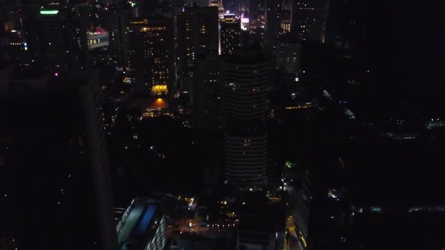 Bangkok Cityscape Expressway and Highway top view at night, Thailand. Night city with skyscrapers top view. Aerial view of traffic at toll on expressway