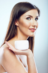 Beauty face portrait of woman holding jar cream.