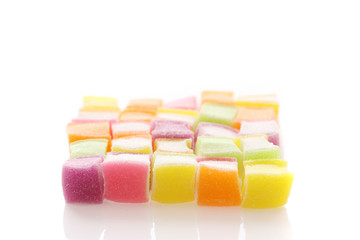 Colorful cube jelly candy isolated in white background