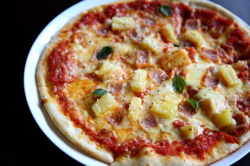 Hawaiian pizza , Pizza with ham pineapple cheese on wood background