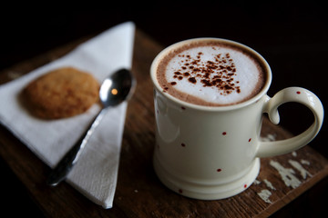 Hot chocolate on wood background