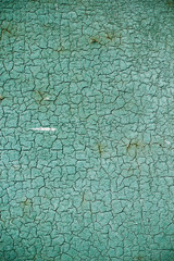 cracked green paint on an old metallic surface, rusted green painted metal wall, sheet of rusty metal with cracked and flaky paint