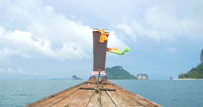 Boat ride through the warm and tropical waters near Railay Thailand
