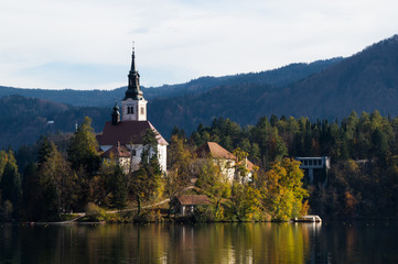 The beautiful Bled island and its church basking in the late evening sunshine