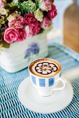 Cup of coffee on table in the morning