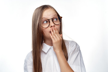 a girl in a white shirt and glasses is surprised