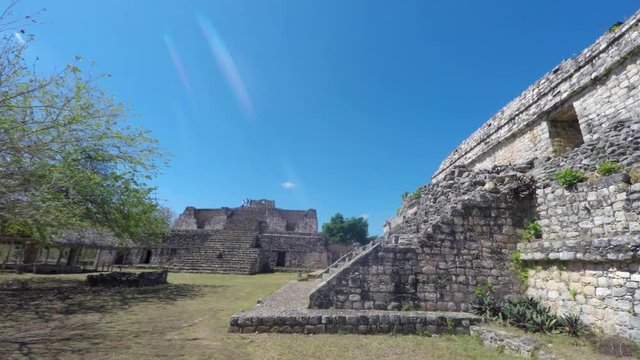 Gimbal panning shot of woman at Ek Balam Mayn Ruins Ball Court