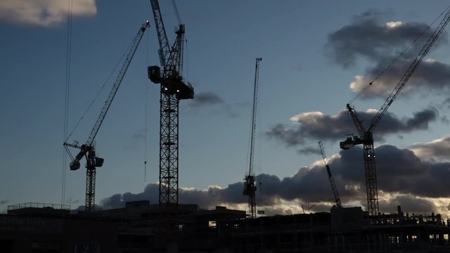 UK November 2017 - time lapse of cranes on a construction site at sunset.