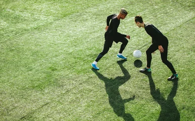 Foto op Plexiglas Soccer players in action on field © Jacob Lund