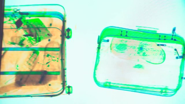 Various personal items from passengers scanned in the x-ray machine