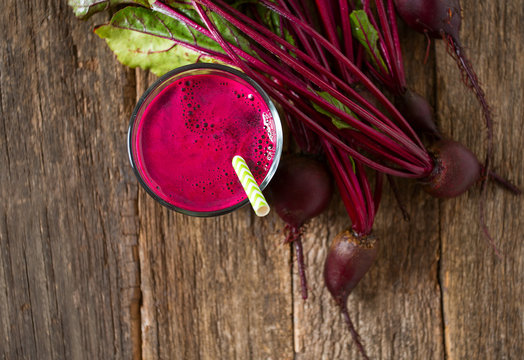 beetroot juice on wooden surface
