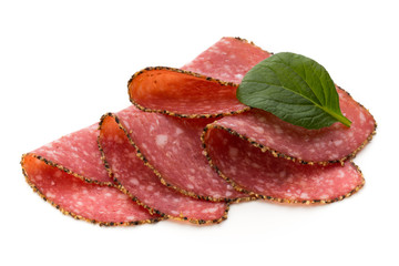 Salami slices isolated on the white background.