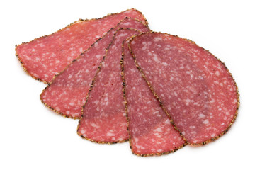 Salami slices isolated on the white background.