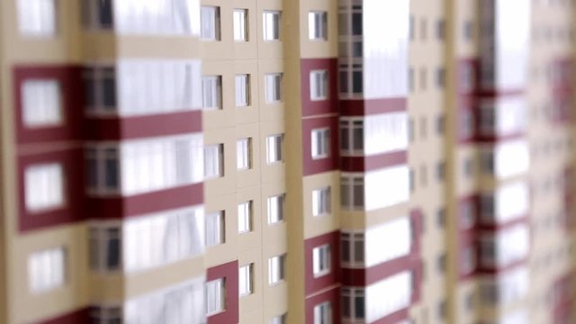 Paper models of condominium and city dwelling houses. Architecture, design and real estate concept.
