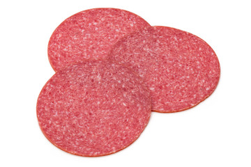 Salami slices isolated on the white background.
