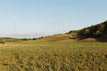 Obraz premium Field and hill in a village